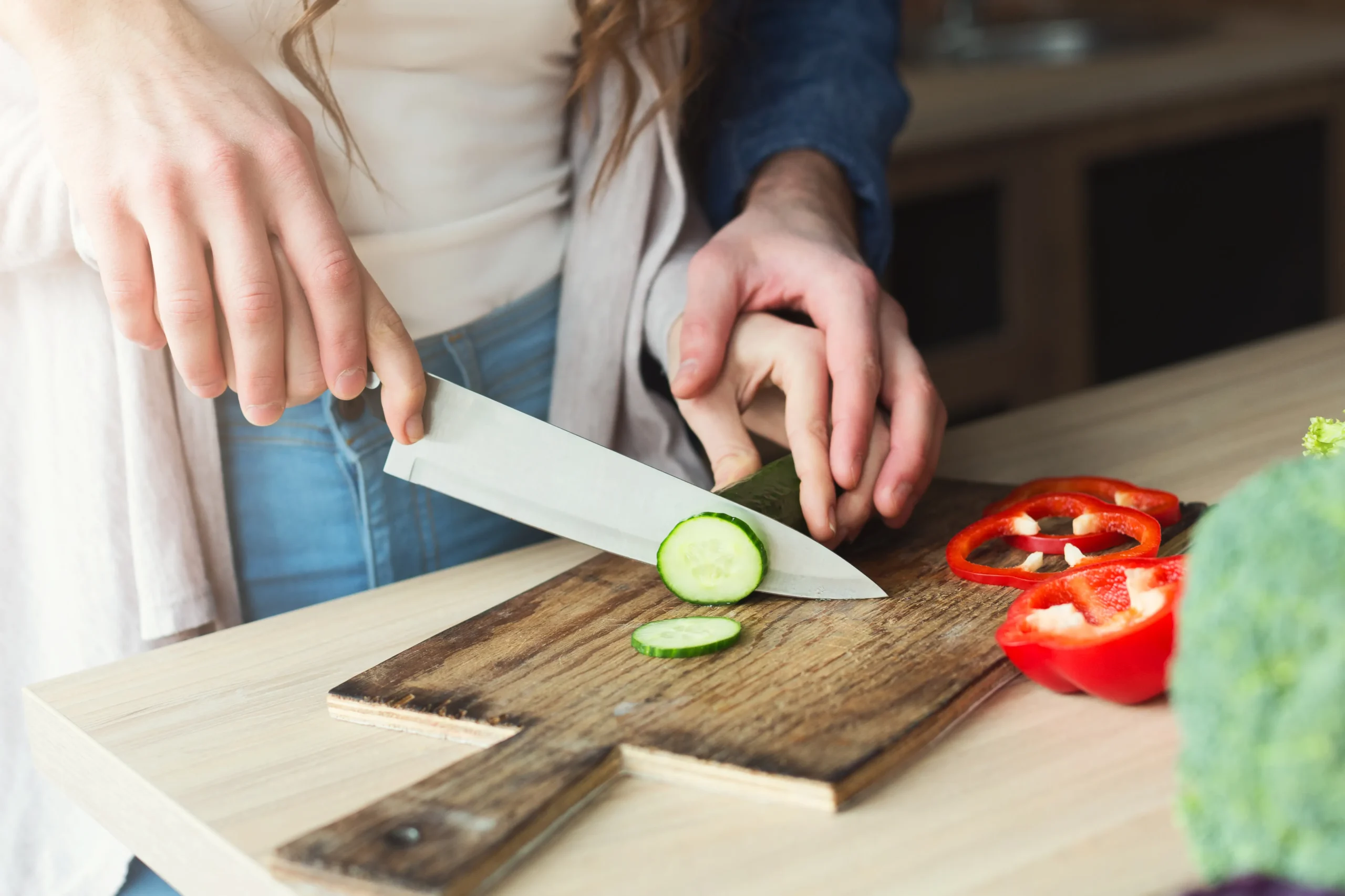 closeup-of-couple-cooking-healthy-food-together-2023-11-27-05-32-54-utc